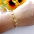Pulseira de coração vazado e trabalhado folheada a ouro 18k