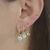 Trio de argolinhas com pingente de coração e pedra cristal folheado a ouro 18k
