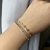 Pulseira Riviera, com Zircônias Lilás, Banhada em Ouro 18k