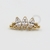 TN319 Topo Cluster 3 Navetes Titânio PVD Gold