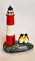 Adorno Faro y Pingüinos de Resina - comprar online