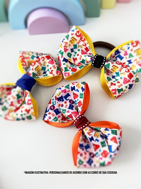 Laços escolar alfabeto G- 10cm - unidade- presilha ou Rabico