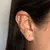 Piercing onda cravejada