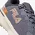 Zapatilla deportiva Fila Duality 2 en colores grafito, negro y cobre para mujer, con malla transpirable y suela blanca
