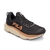 Zapatillas de correr para mujer en color negro con detalles cobre y suela blanca
