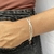 Pulseira fio duplo coração
