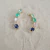 Brinco earcuff com cristais de zirconias e banho de ouro