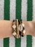 MIX DE PULSEIRAS PRETO E DOURADO BÚZIOS, CONCHAS E OLHO GREGO