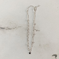 Tobillera cadena con bolitas y dije estrella