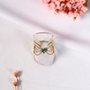 Anel Trabalhado com Zircônia Verde e Mini Zircônia Cristal Ouro 18k