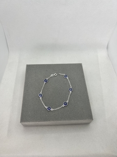 Pulseira olho grego azul escuro.