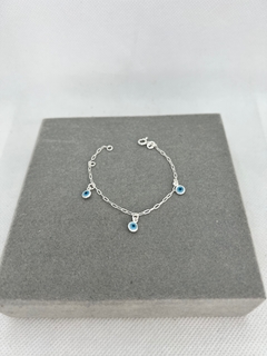 Pulseira para bebê com olho grego pendurado . - comprar online