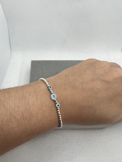 Pulseira silicone bolinhas de prata e olho grego . - comprar online