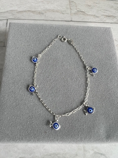 Pulseira olho grego peixinho azul escuro.