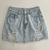 Pollera jeans con roturas celeste