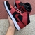Tênis Air Jordan 1 Mid Reverse Bred