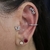 Labret 3 flores cravejadas - Aline Tchekmenian Fine Piercing