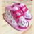 ZAPATILLA BLANCA CON FLORES Y BORDE FUCSIA