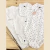 BODY CAMISA BLANCO HOJAS AZULES