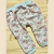 PANTALON T4 BABUCHA FRISA CELESTE CON FLORES ROSA