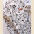 BODY CAMISA BLANCO CON FLORES NEGRAS
