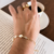 Pulseira pearl corrente na internet