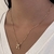 COLAR COM CORAÇÃO E CASAL CRAVEJADO DOURADO na internet