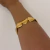 PULSEIRA TRIANGULOS DOURADO na internet