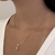 COLAR CRUZ CREVEJADA PEQUENA DOURADO - loja online