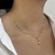 COLAR CORAÇÃO LISO VAZADO COM MENINA CRAVEJADO DOURADO - comprar online