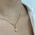 COLAR CORAÇÃO LISO VAZADO COM MENINA CRAVEJADO DOURADO - Olimavie Semijoias