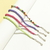 Conjunto com 4 Pulseiras de Bolinhas - Roxo, Rosa e Verde
