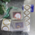 Kit Bolsa Bucha Saquinho + 4 Sabonetes Artesanais Naturais Sortidos de 55g Cada + Adesivo Comemorativo - Bazar Completo