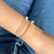 Pulseira coração ponto de luz folheado premium - comprar online