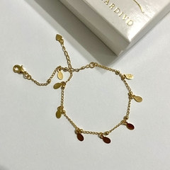 PULSEIRA COM MEDALHAS EM FORMA DE GOTA 18K na internet