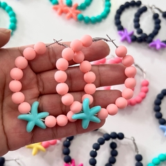 12 pares de brincos argola miçanga com estrela sortidos na internet