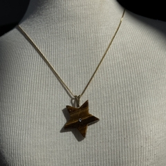 PINGENTE ESTRELA C/ STRASS- OLHO DE TIGRE na internet