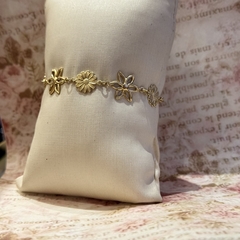 PULSEIRA MARGARIDAS (OURO) - Nova Topázio