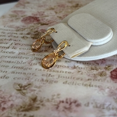 BRINCO GOTA INFINITY ZIRCONIA (OURO) na internet