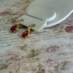 BRINCO GOTA INFINITY ZIRCONIA (OURO) - Nova Topázio