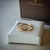 Imagem do The Graces - Anel em Ouro Amarelo 18k com fios entrelaçados decorado por diamantes.