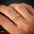 Imagem do The Graces - Anel em Ouro Amarelo 18k com fios entrelaçados decorado por diamantes.
