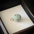 Colar com safiras naturais, fecho em ouro 18k e pingente esmaltado com passador em ouro 18k. na internet