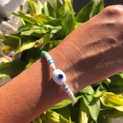 Pulseira com disquinhos coloridos na internet