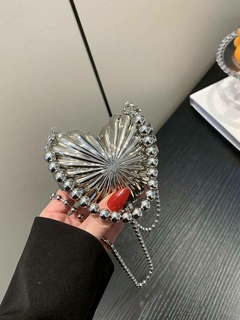 Bolsa mini coração alça metal na internet