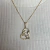COLAR CORAÇÃO MAMÃE COM BEBÊ BANHADO A OURO 18K - comprar online