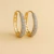 Brinco argola alongada com microzircônias cravejadas na frente banhado a ouro 18k - 69696565 na internet
