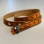 Pulseira fita métrica em couro laranja