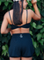 Conjunto Fitness Preto - top torcido + short duplo com bolso na internet