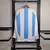 blusa-camiseta-camisa-argentina-home-24-25-copa-america-manga-comprida-longa-azul-e-branca-listrada-adidas-patch-campeao-copa-do-mundo